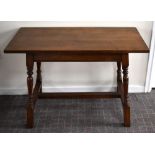 An oak side, hall or centre table with rectangular top above four ring turned slightly outswept
