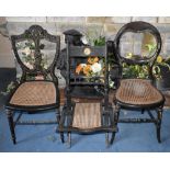 A late 19th century Aesthetic Movement ebonised folding chair with cane seat and two further