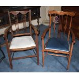 An Edwardian mahogany and inlaid elbow chair and an Edwardian stained beech and inlaid chair (2).