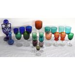 A group of Victorian and later coloured glassware, predominantly glasses including clear stemmed