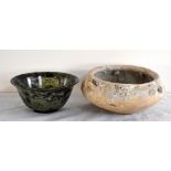 An early Chinese shallow bowl with lug handles and marine encrustation, diameter 13.5cm, and a green