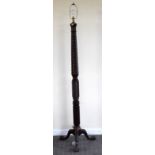 A large early 20th mahogany standard lamp with wrythen twisted column to three floral knee carved