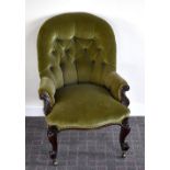 A Victorian walnut framed nursing chair with button upholstered back, arms and seat on cabriole