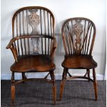 A set of ten reproduction ash and elm hoop back Windsor chairs, each with saddle seat and turned