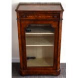 A Victorian figured walnut and inlaid pier cabinet with three quarter brass gallery above single