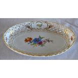 MEISSEN; an early 20th century pierced oval bowl painted with floral sprays, painted mark, impressed
