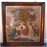 A large Victorian woolwork depicting Moses amoungst the bullrushes in a period walnut frame (af),