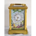 A 20th century brass carriage clock with painted dial and side panels, the back plate inscribed '