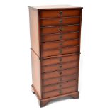 A reproduction floor standing CD cabinet comprising six fitted drawers with ring drop handles,