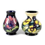 Two small Moorcroft vases to include 'Pansy Parade' pattern baluster vase with flared neck,