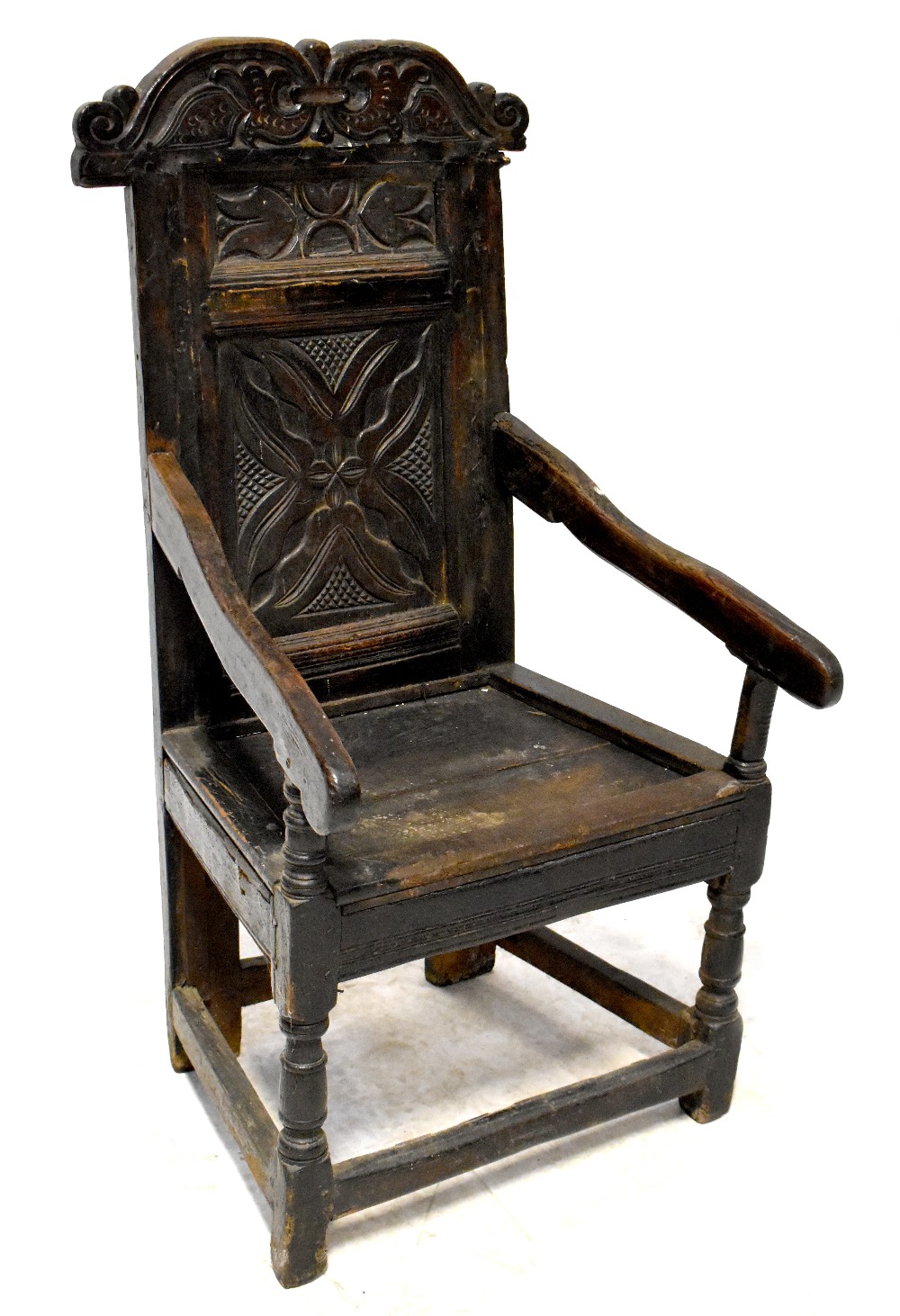 A 17th century carved oak Wainscot armchair,