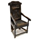 A 17th century carved oak Wainscot armchair,