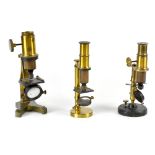A boxed brass small microscope, height 16cm, a similar example on painted base, height 16cm,