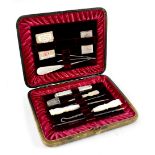 An Edwardian Finnigan of Manchester leather and red satin lined manicure and sewing vanity set
