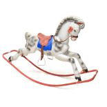 A Tri-ang plastic rocking horse with leather straps and rubber saddle on a metal base,