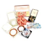 A quantity of mainly contemporary costume jewellery to include jade-effect beads, coral necklaces,