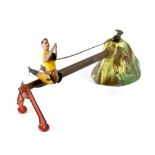 An unusual antique tinplate clockwork acrobat toy,