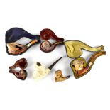Vintage Meerschaum pipes to include a sailor, a lady with hat, an eagle claw,