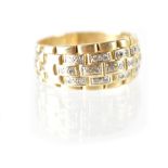 A gentlemen's extra-large yellow metal diamond cluster dress ring with half hoop brick link design,