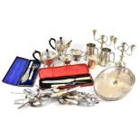 A quantity of silver-plated ware to include a four-piece tea service, candlesticks, tankard,