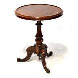 A mahogany circular tilt-top occasional table on a turned tripartite support, 73 x 60cm.