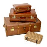 A large vintage 'Vulcan Fibre' brown leather suitcase, length 66cm, a smaller brown leather case,