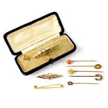 A collection of 19th century gold jewellery to include five scarf pins which include inset tiny