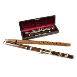 Three 19th century woodwind musical instruments to include a boxed two-section rosewood piccolo (no