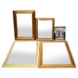 Three gilt-framed wall mirrors, all with bevelled plate, the largest 101 x 75cm,