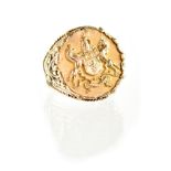 A gentlemen's 9ct gold ring with central round panel with double unicorn crest,