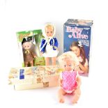 Three vintage boxed dolls to include a German doll in 1960s clothes,