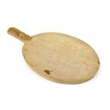 A Robert 'Mouseman' Thompson cheese board with carved mouse, length 38cm.