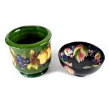 A Moorcroft limited edition green ground 'Fruit and Vine' pattern jardinière designed by Marjorie