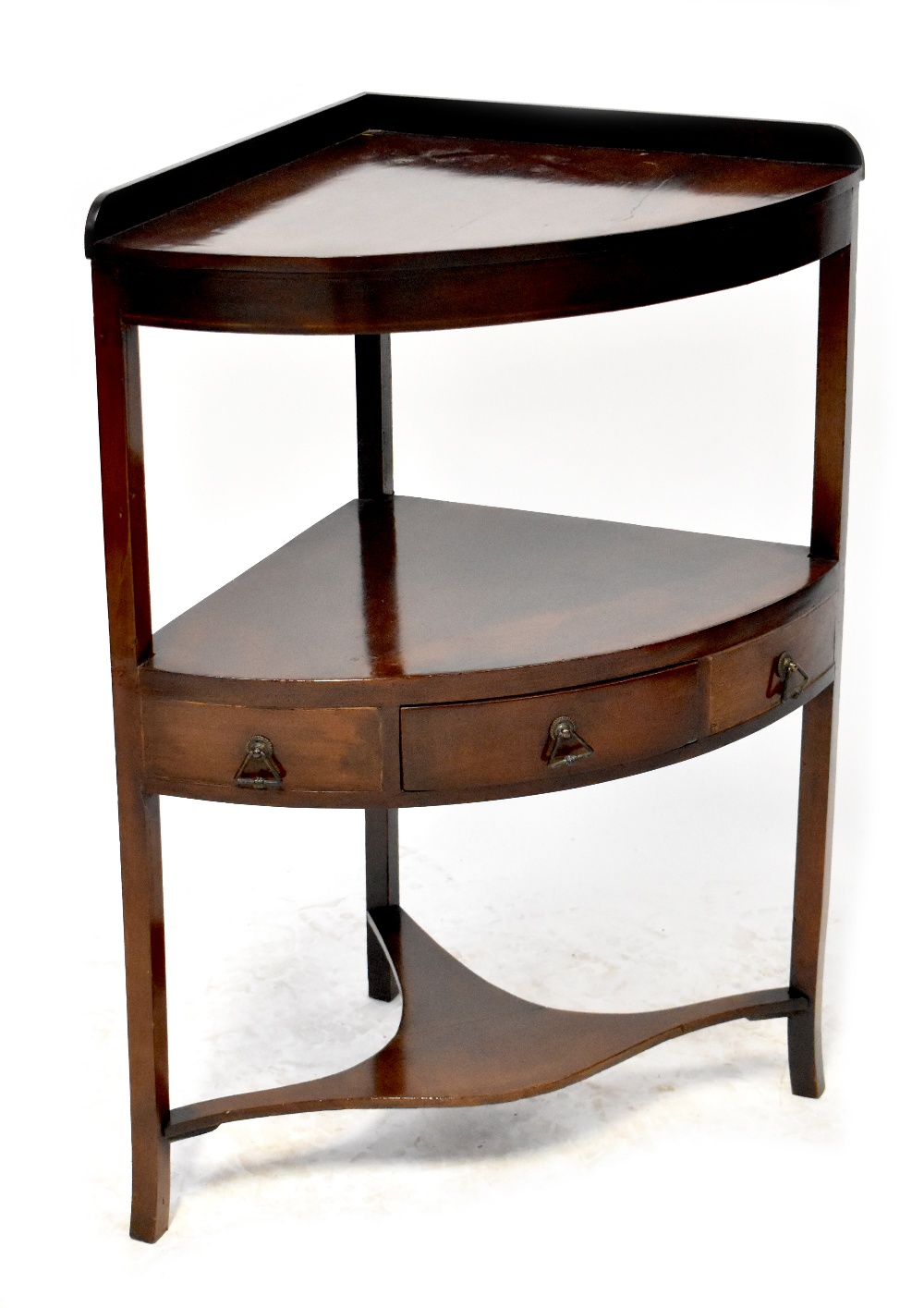A 19th century mahogany corner washstand of two tiers with three trinket drawers above an undertier,