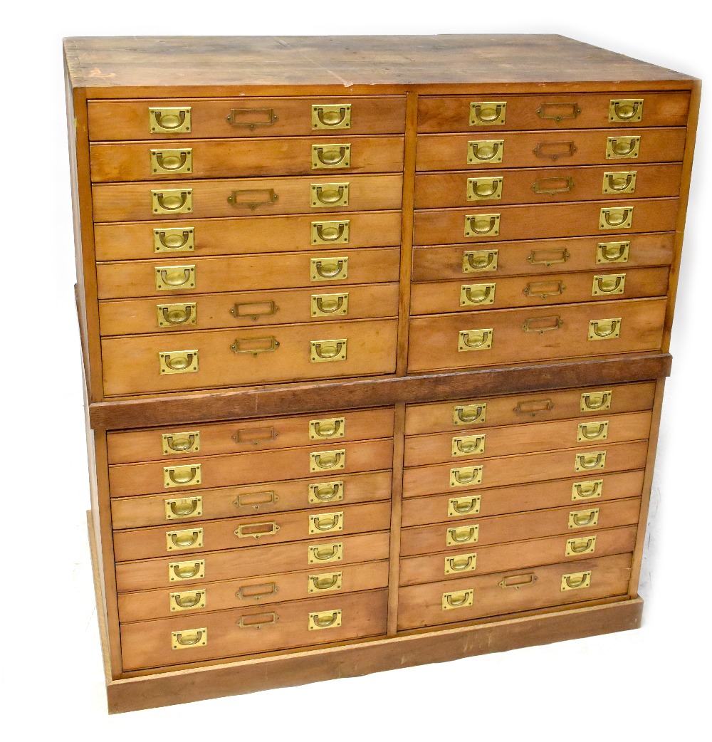 An early 20th century stained pine museum-style chest of collectors' display drawers,