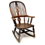 A 19th century provincial Windsor rocking chair, hoop back,