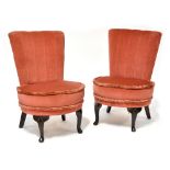 A pair of 1940s low side chairs raised on cabriole legs (2).