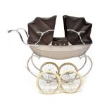 A Silver Cross double dolls' pram in light brown colourway with brown material.