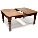 A Victorian mahogany extending dining table, for restoration, on bulbous turned tapering legs,