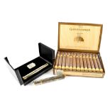A Guantanamera box containing twenty-five cigars in sealed tubes together with a gift case