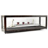 A 20th century scratch-built wood display model of the 'Queen Mary' in a glazed wooden presentation