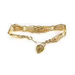 A modern hallmarked 9ct gold four bar gate bracelet with heart-shaped clasp, length approx 17cm,