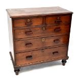 A 19th century mahogany chest of two short over three drawers with later handles, on turned feet,