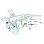 A quantity of boxed silver jewellery to include ladies' dress rings set with coloured and