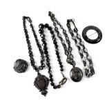 Various items of 19th century Whitby jet style jewellery to include four necklaces,