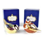 Two boxed Royal Crown Derby bird paperweights, a tit with gold stopper,