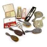 Two early 20th century silver-backed hair brushes, two plated hand mirrors, three hair brushes,