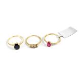Three 9ct yellow gold ladies' dress rings, one set with three small champagne-coloured stones,