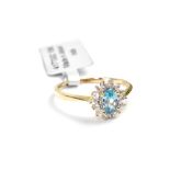 A 10ct yellow gold ladies' dress ring, floral-set with central topaz and diamond surround, size P,