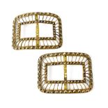A pair of George III brass shoe buckles with double beaded trellis border.